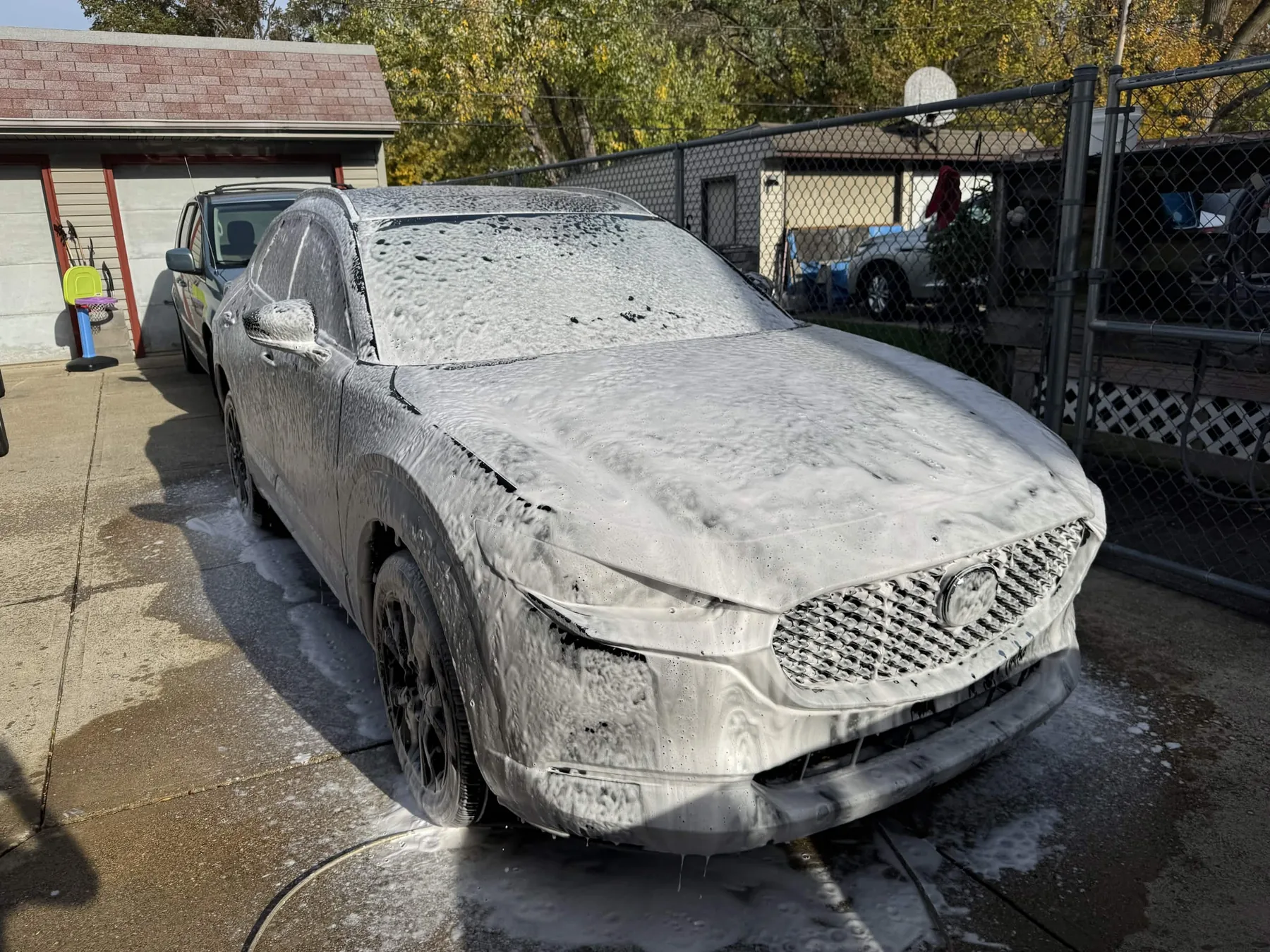 SUV covered in thick foam during a North Olmsted exterior car detailing wash